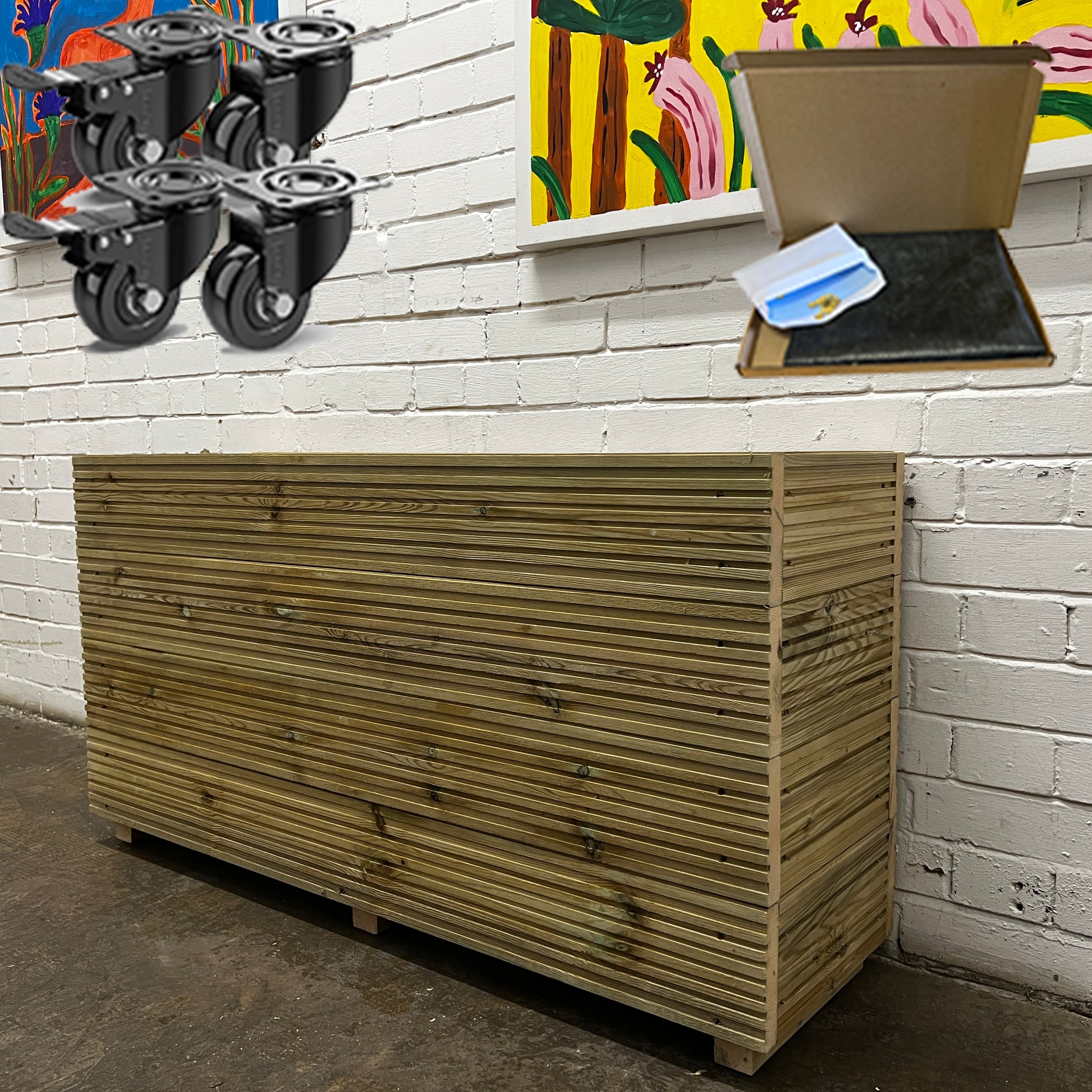 Handmade wooden decking planter with a false bottom, 4ft long and 2ft tall, featuring a set of wheels and liner.