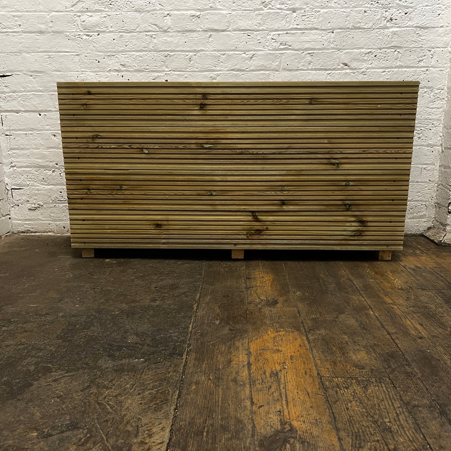 Handmade wooden decking planter with false bottom, 4ft long, 2ft tall, front.