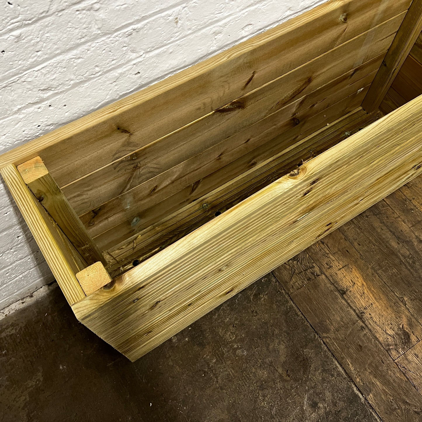 Handmade wooden decking planter with false bottom, 4ft long, 2ft tall, inside pre-view.