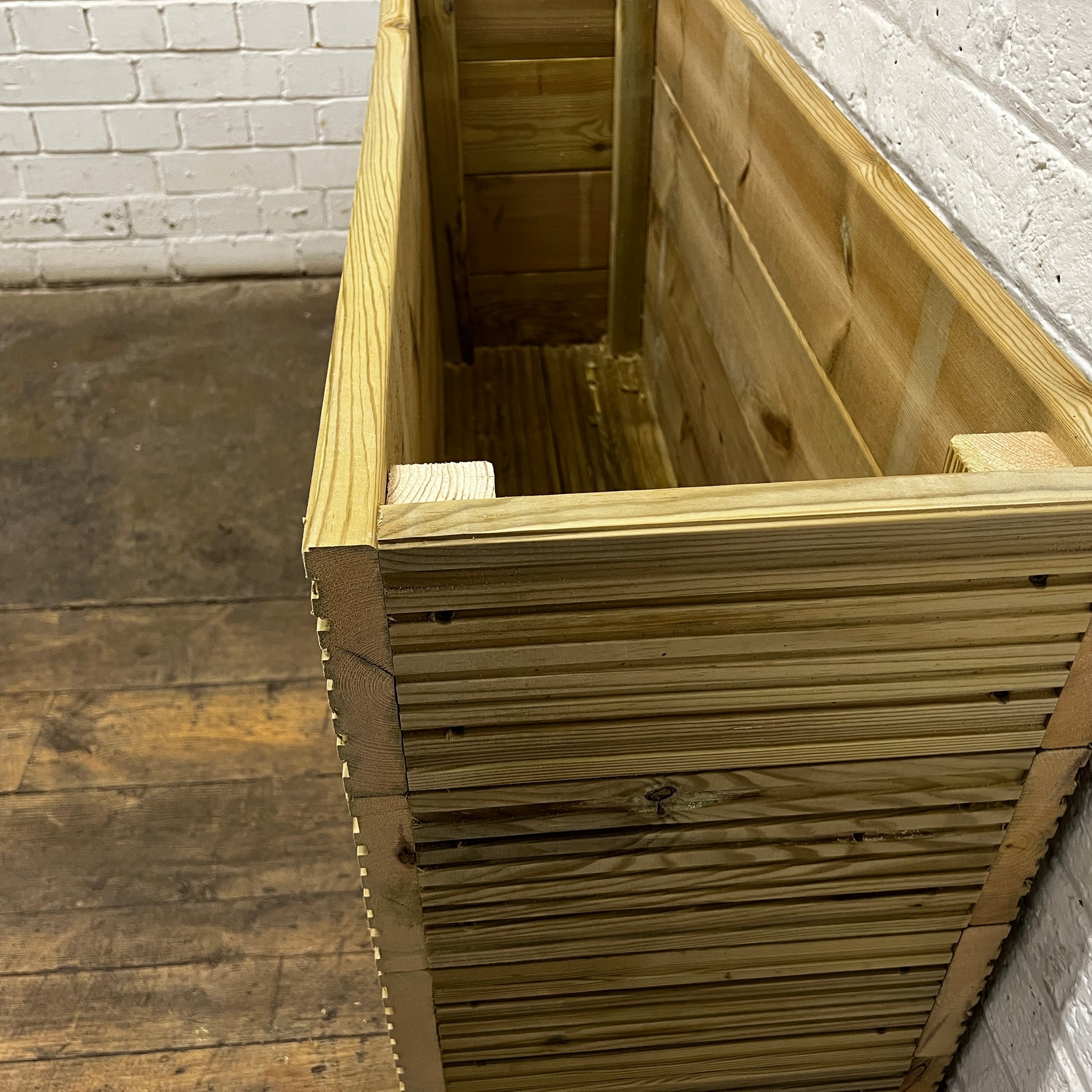 Handmade wooden decking planter with false bottom, 4ft long, 2ft tall, right side.